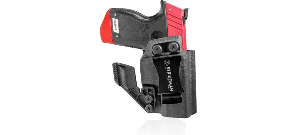 Red and black Strikeman SIRT training pistol secured inside an adjustable holster.