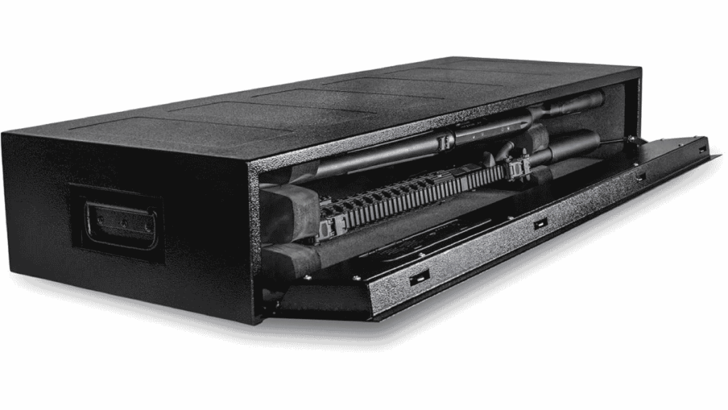 Black under-bed gun safe shown partially open with a rifle stored inside.