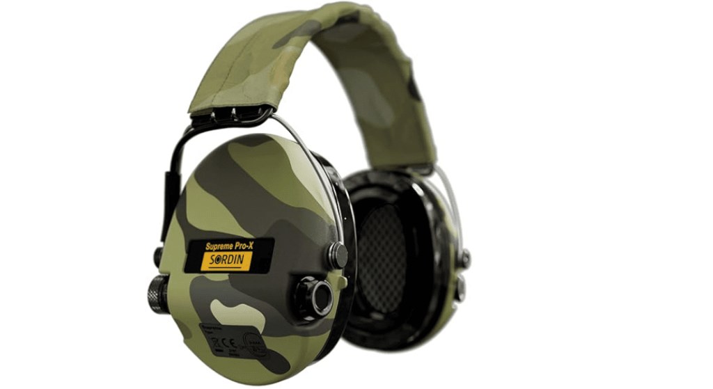 Camouflage over-ear shooting earmuffs with padded headband on a white background.