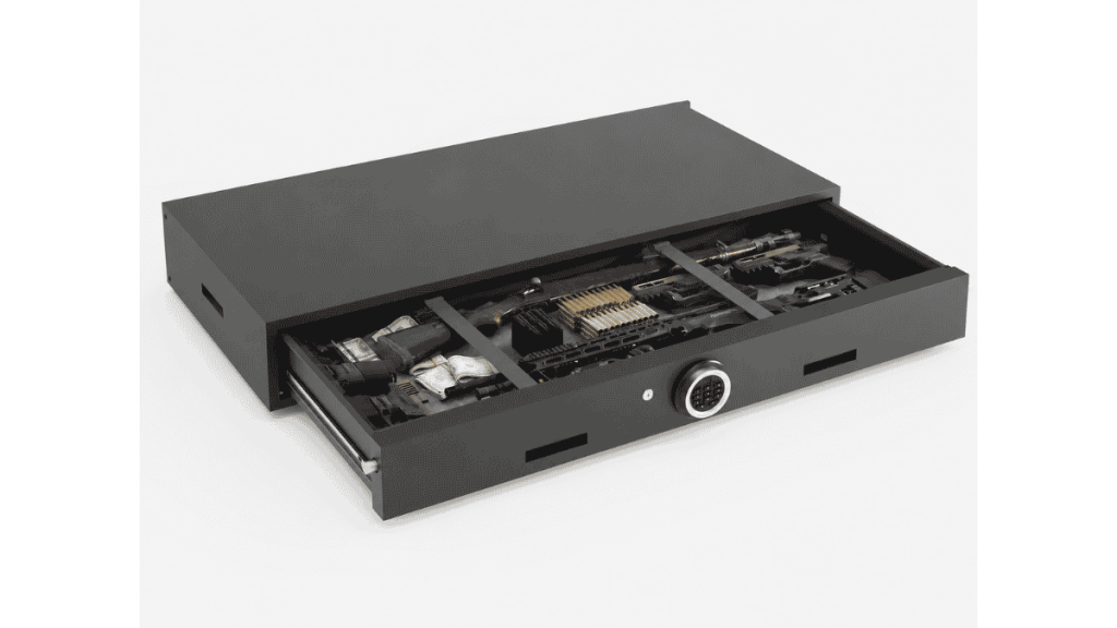Open under-bed gun safe with rifles, handgun, ammunition, and valuables stored inside a slide-out drawer.