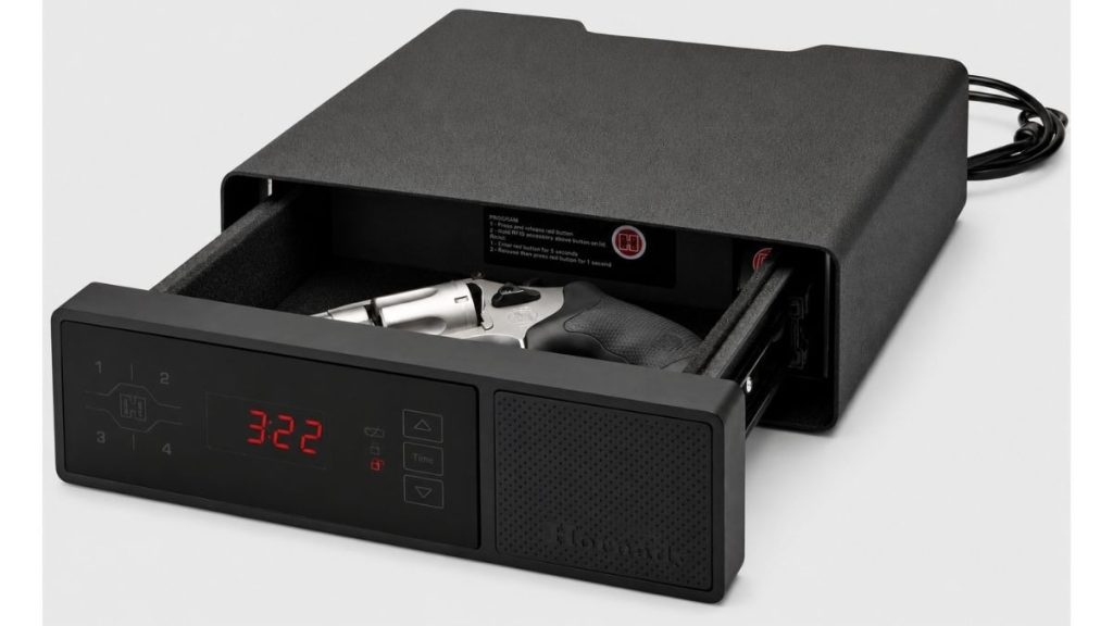 Hornady-style bedside handgun safe with open drawer, digital clock display, and revolver inside.